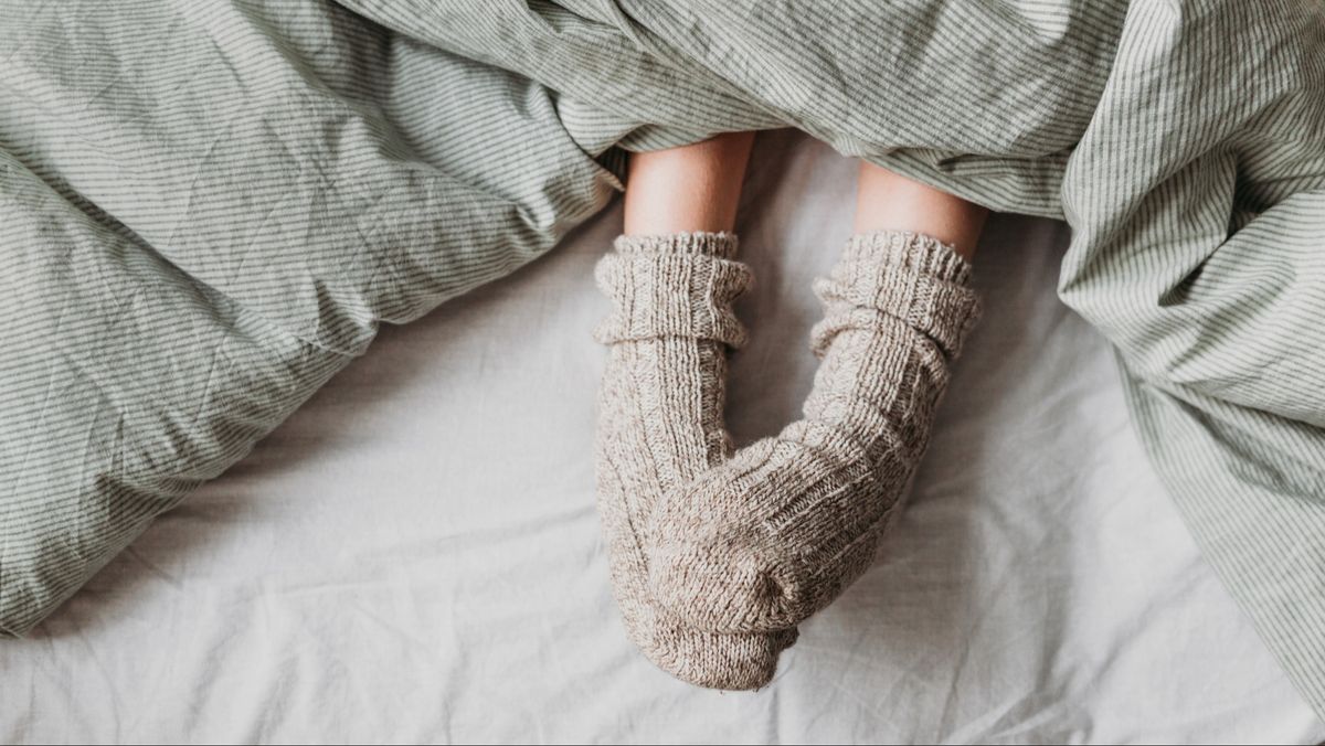 Wearing socks to bed helps you fall asleep faster and stay asleep longer — here’s why